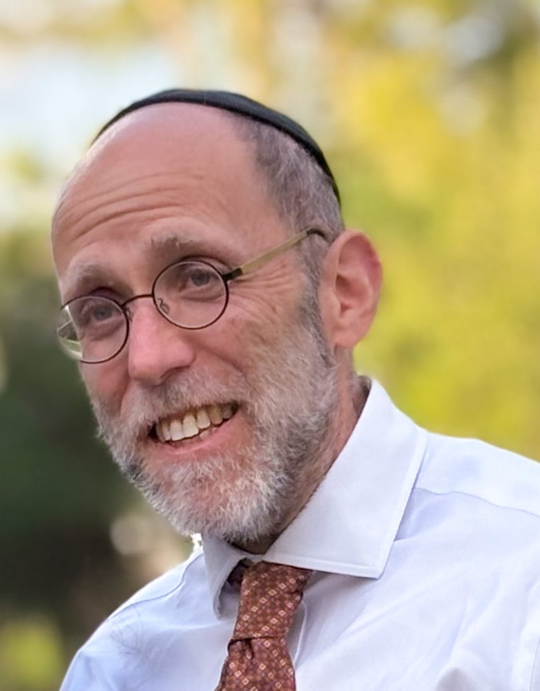 Shaya Benstein, smiling, outdoors